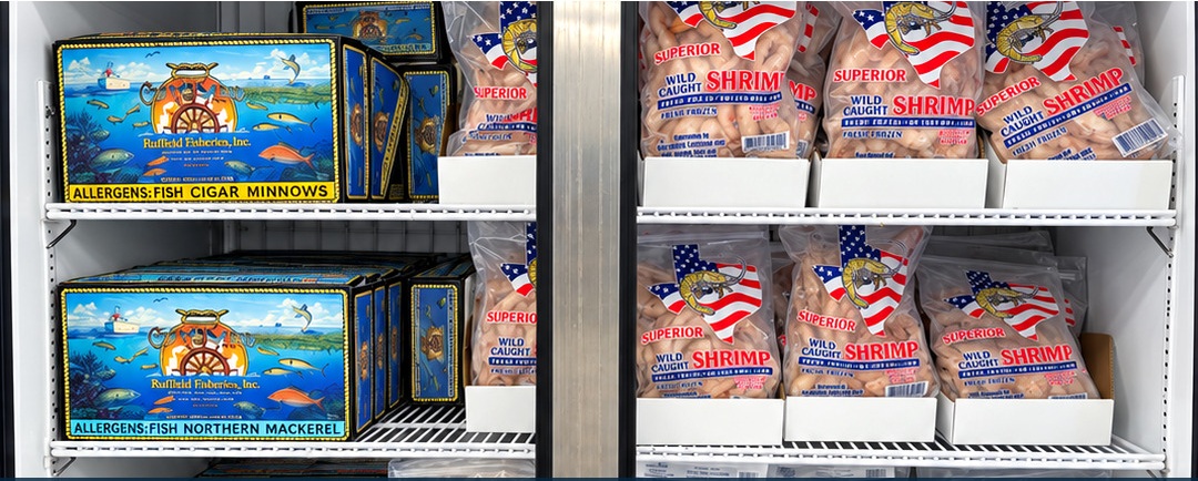 Packaged Coastal Bait products displayed in a retail freezer